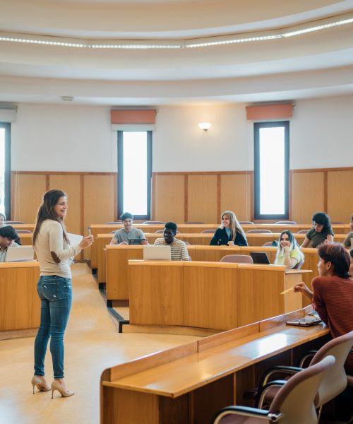 Cheerful teacher and students during lecture